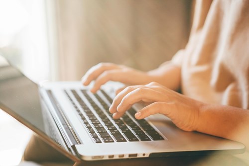 Person working on a laptop computer